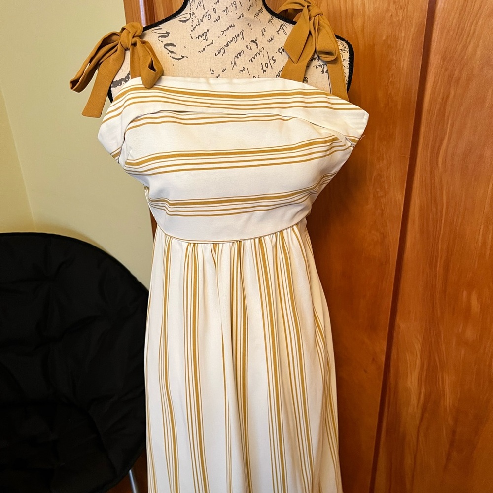 Selling lot of 3 outfits, 2 dresses and 1 romper.